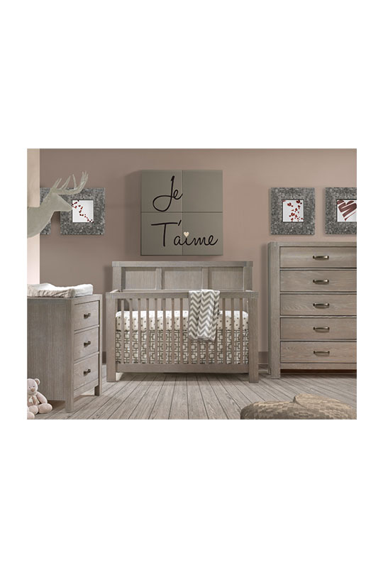 Dark bedroom with wooden floors and wooden 3 drawer dresser, 5 drawer dresser and crib