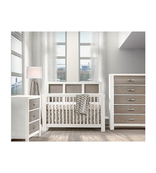 Light baby nursery with white and brown wood 3 drawer dresser, 5 drawer dresser and crib