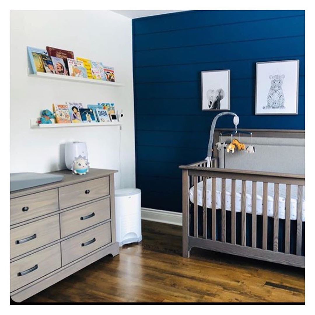 White nursery with white crib and double dresser