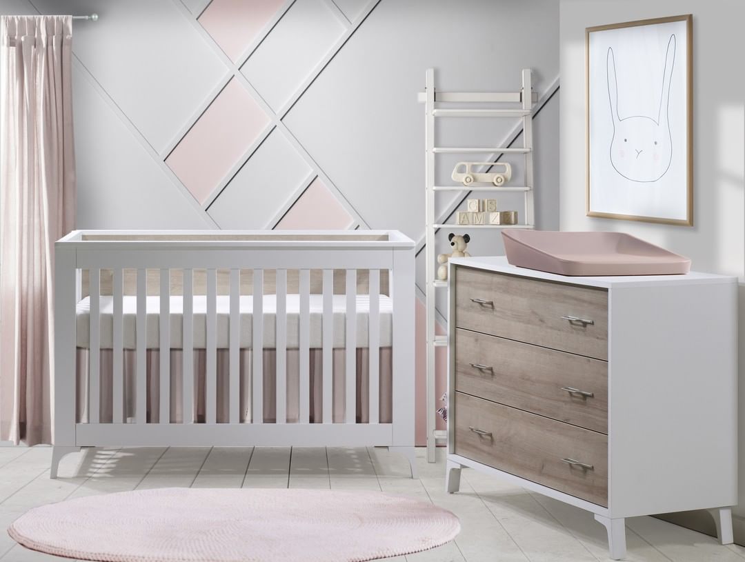 White nursery with white crib and double dresser